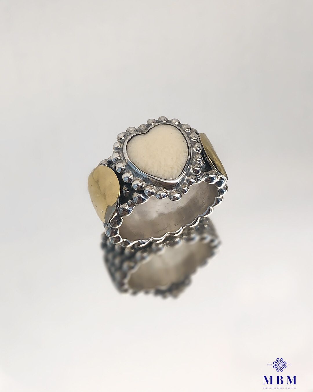 Silver and gold ring with heart