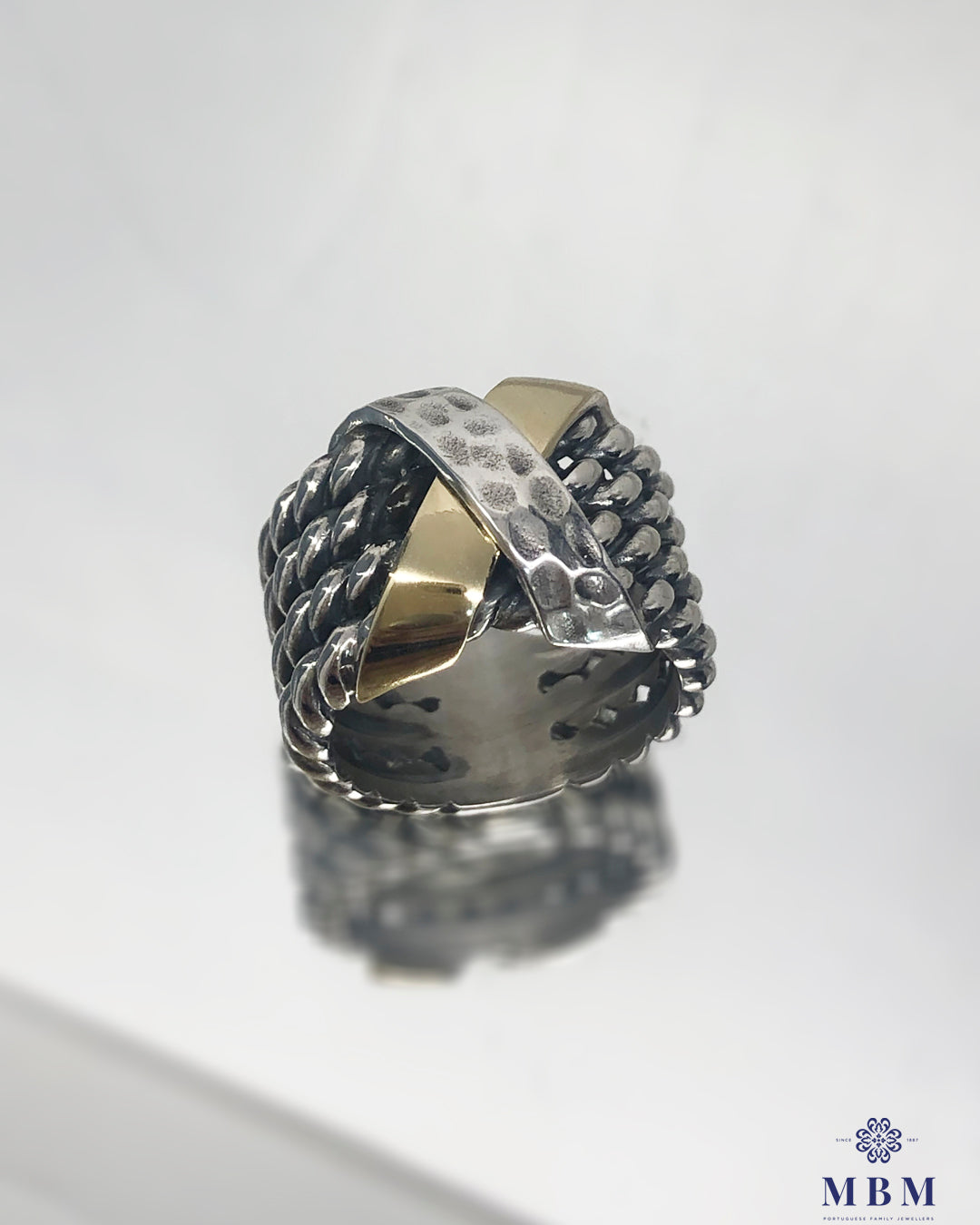 Silver and gold "X" ring