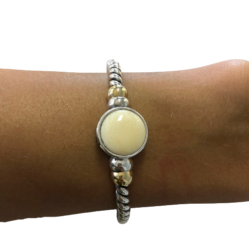 Bracelet in silver, gold and vegetable ivory.