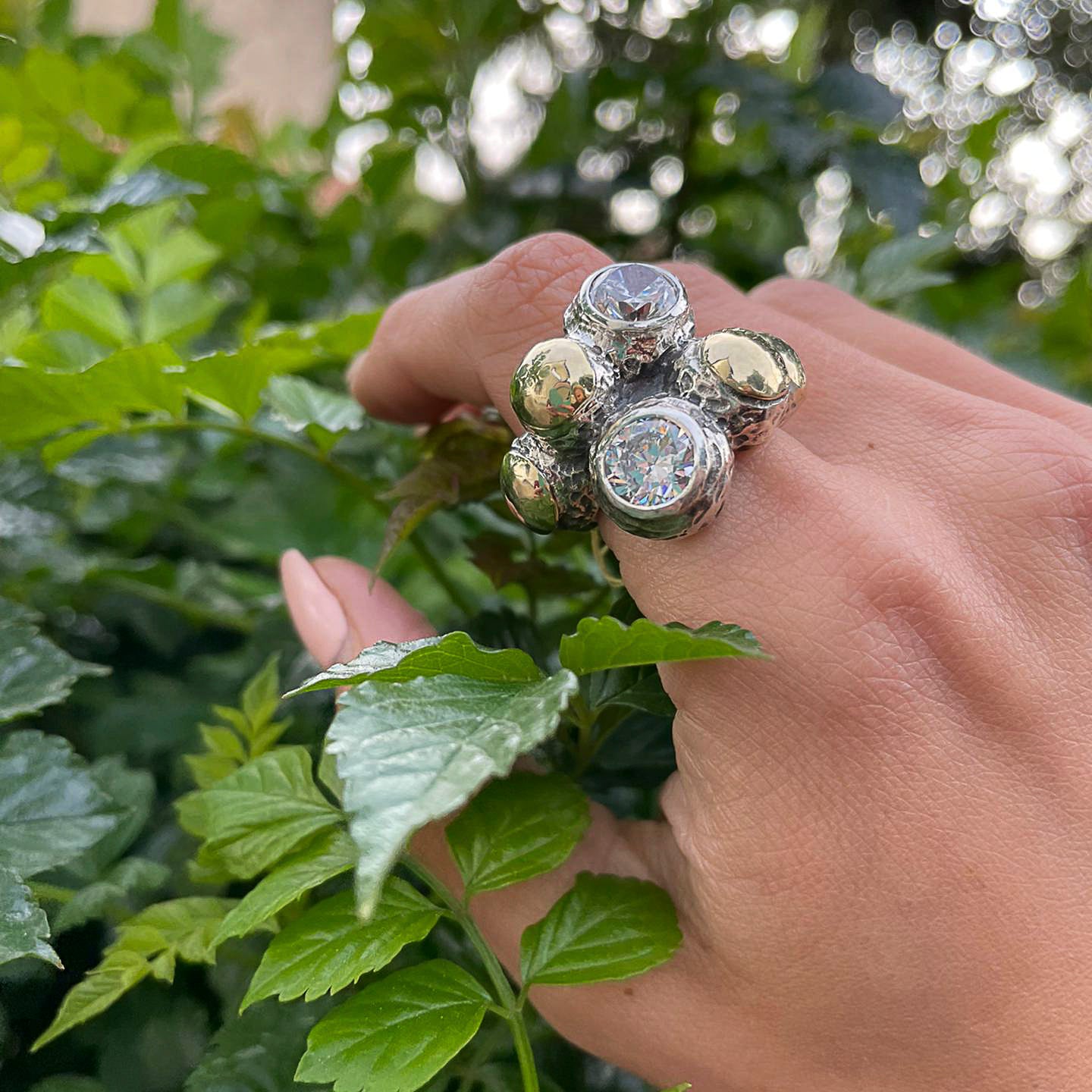 Wide ring in silver and gold with zircons