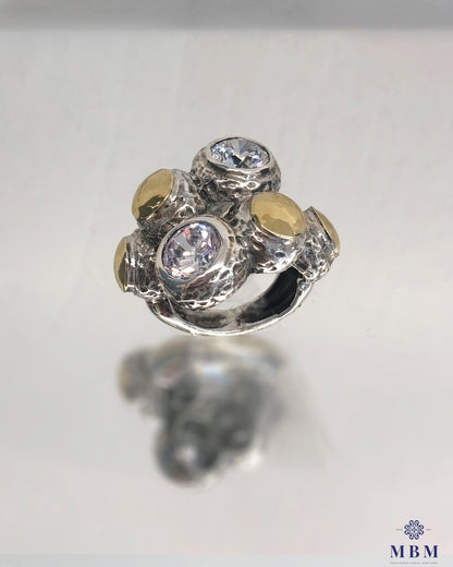 Wide ring in silver and gold with zircons