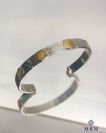 Silver bracelet with gold circles