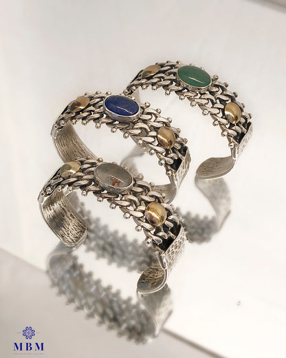 Wide bracelets in silver and gold with natural stones